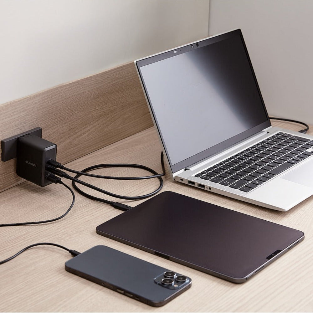 Charger GaNII 100W shown charging a laptop, ipad, and iphone at once - Max output 100 watts