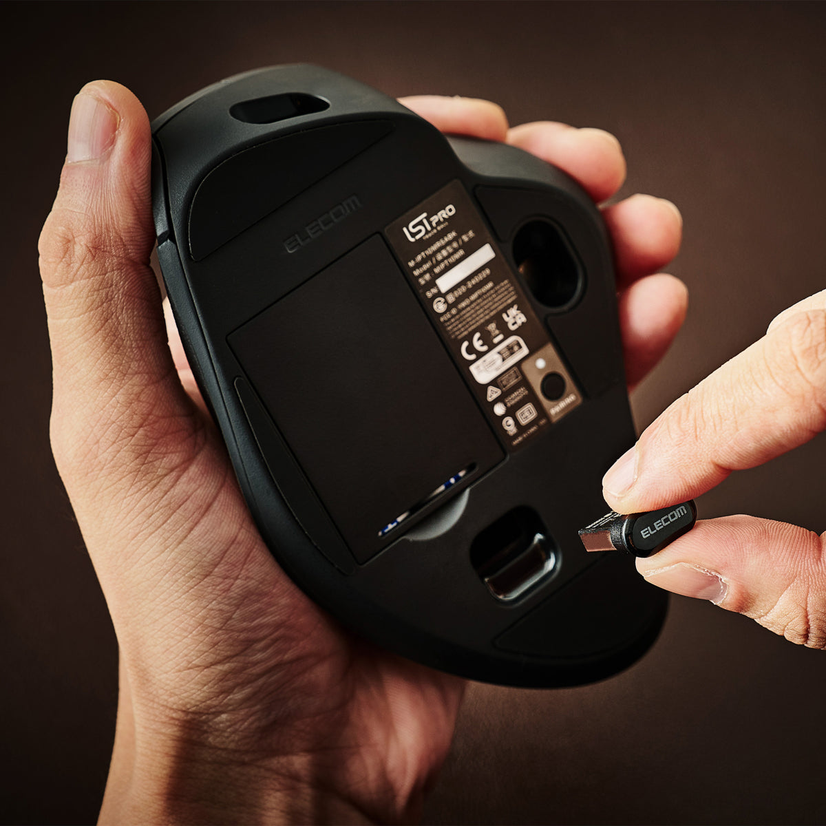 usb dongle for wireless trackball mouse | battery cavity under IST Pro Trackball Mouse