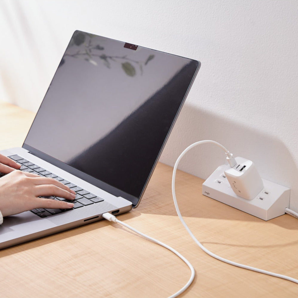 Black Compact Charger GaNII 65W hand hands working on laptop and charger plugged into laptop | Elecom ultra-high output device charger