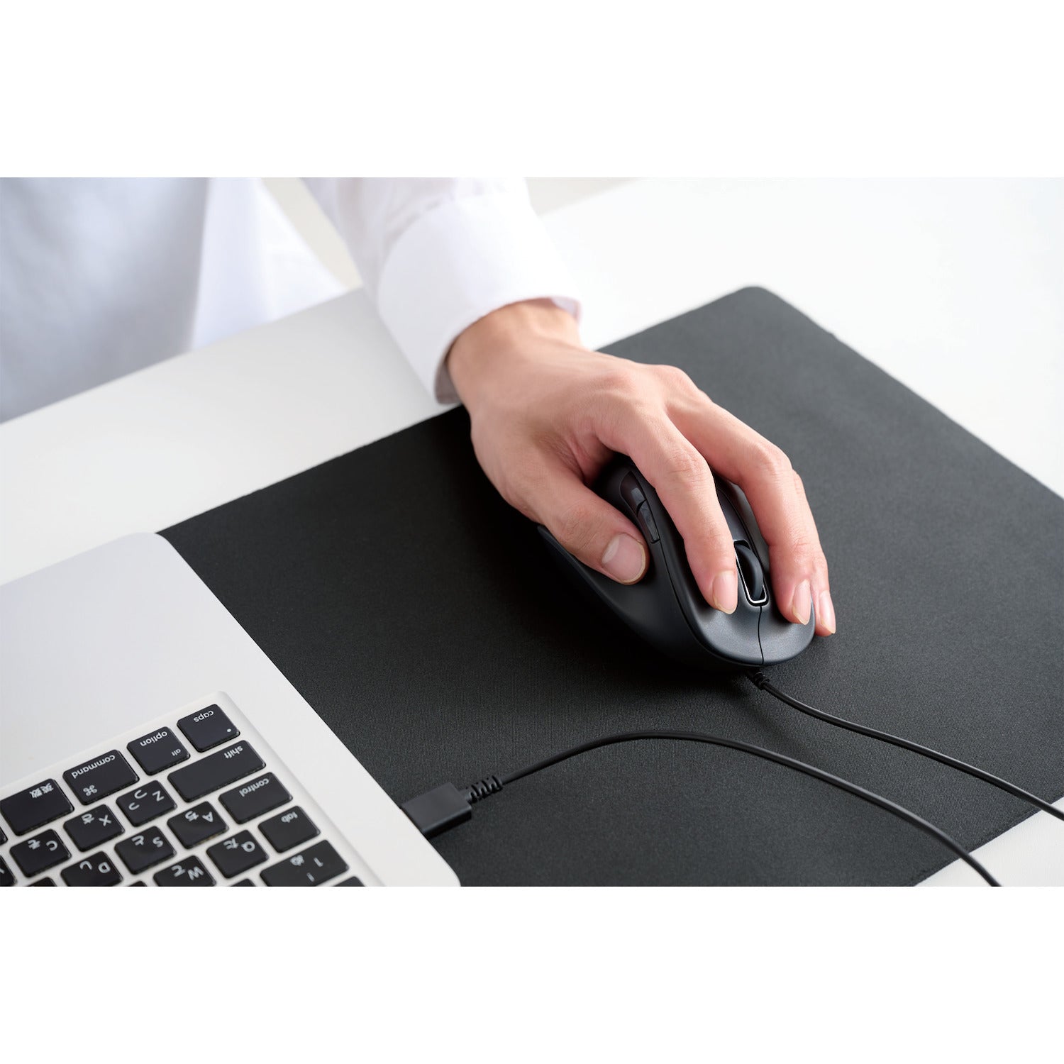in use shot | black wired ergonomic mouse