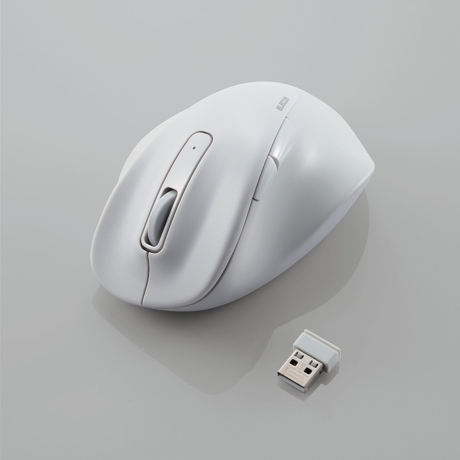 white wireless mouse with usb connectivity piece