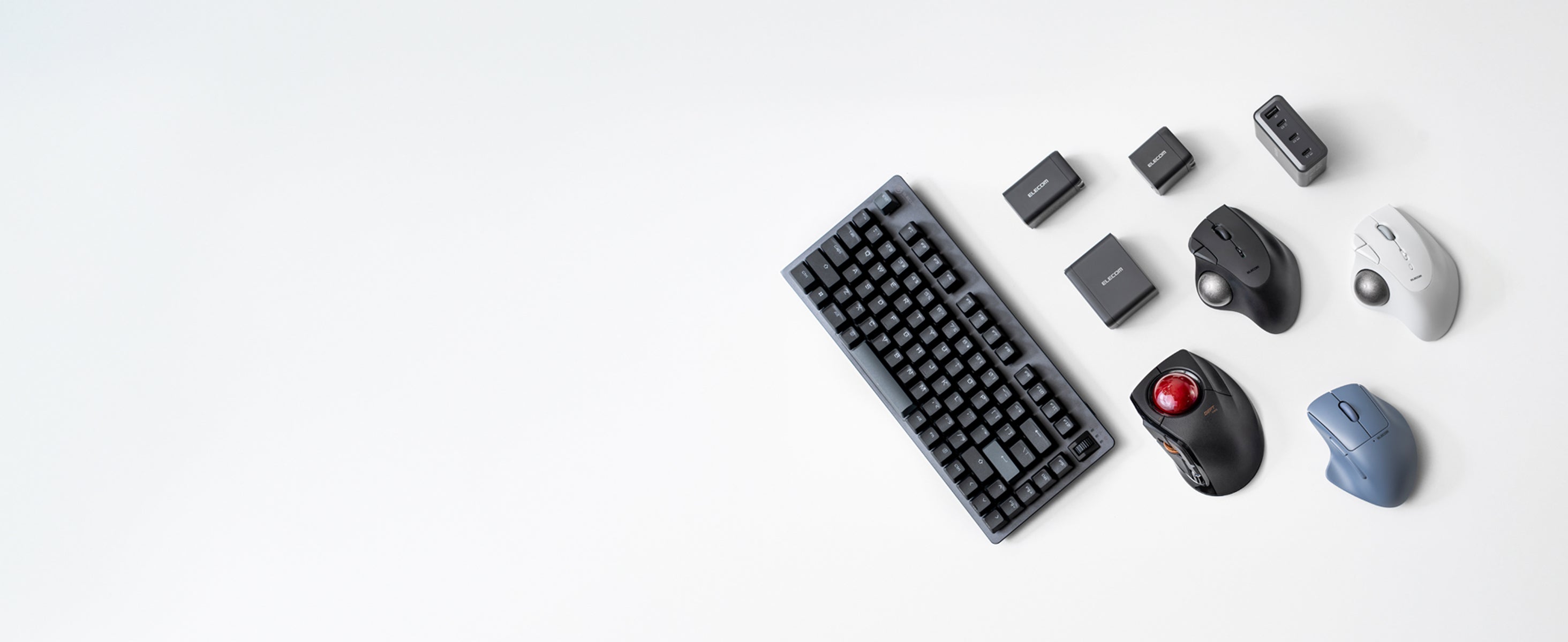 Collection of computer keyboards and mice on a white background