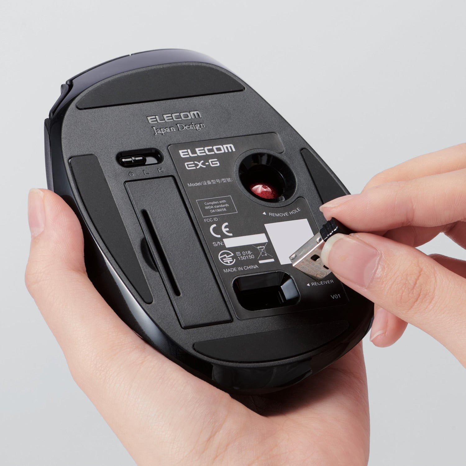 Hands storing USB Receiver under mouse | Wireless Trackball Mouse