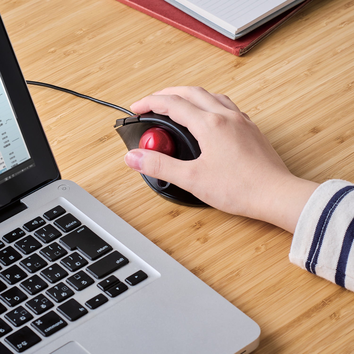 Using Black EX-G Trackball Wired Red Ball next to laptop on a table | Elecom Wireless Trackball mouse