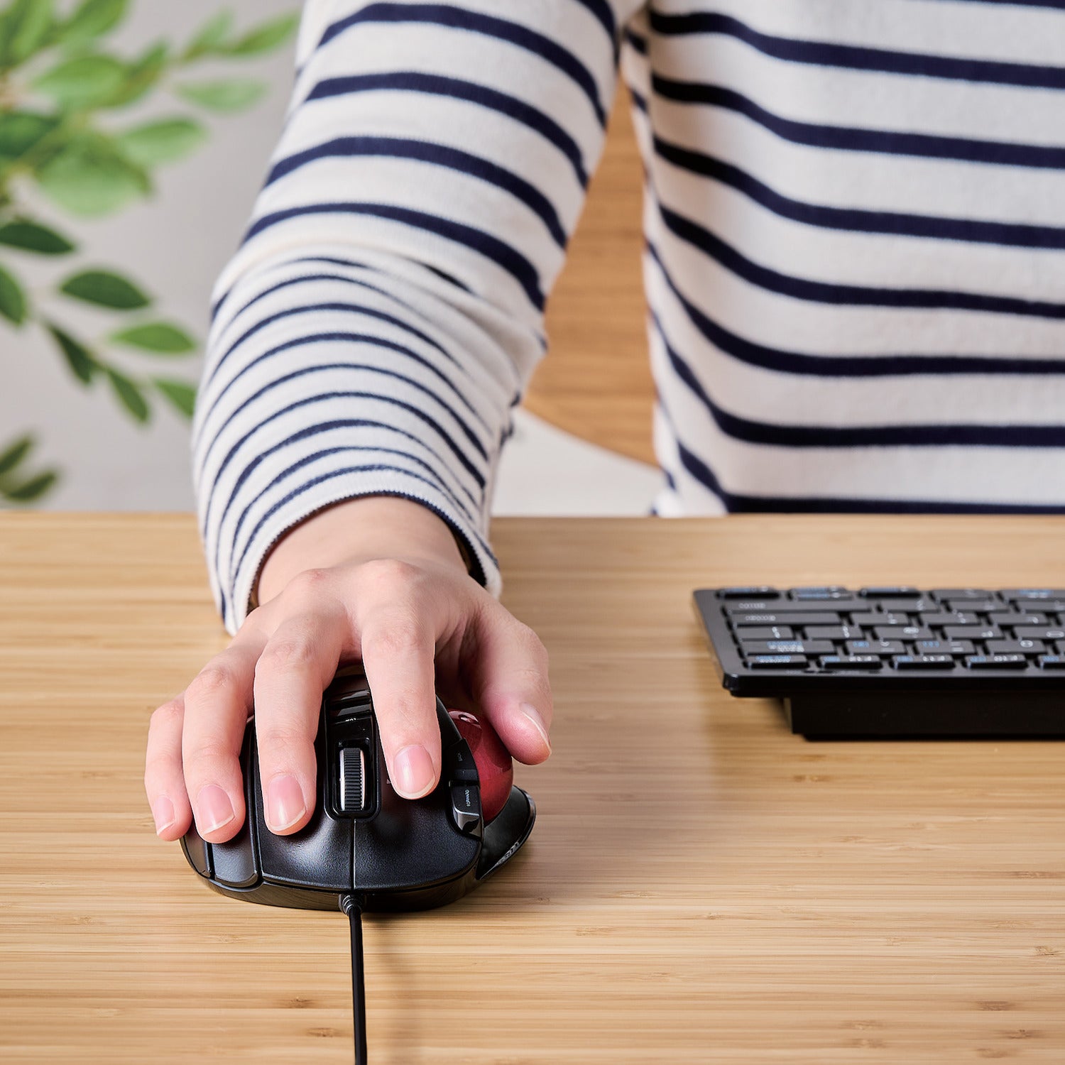 Using Black EX-G Trackball Wired Red Ball next to keyboard on a table | Elecom Wireless Trackball mouse