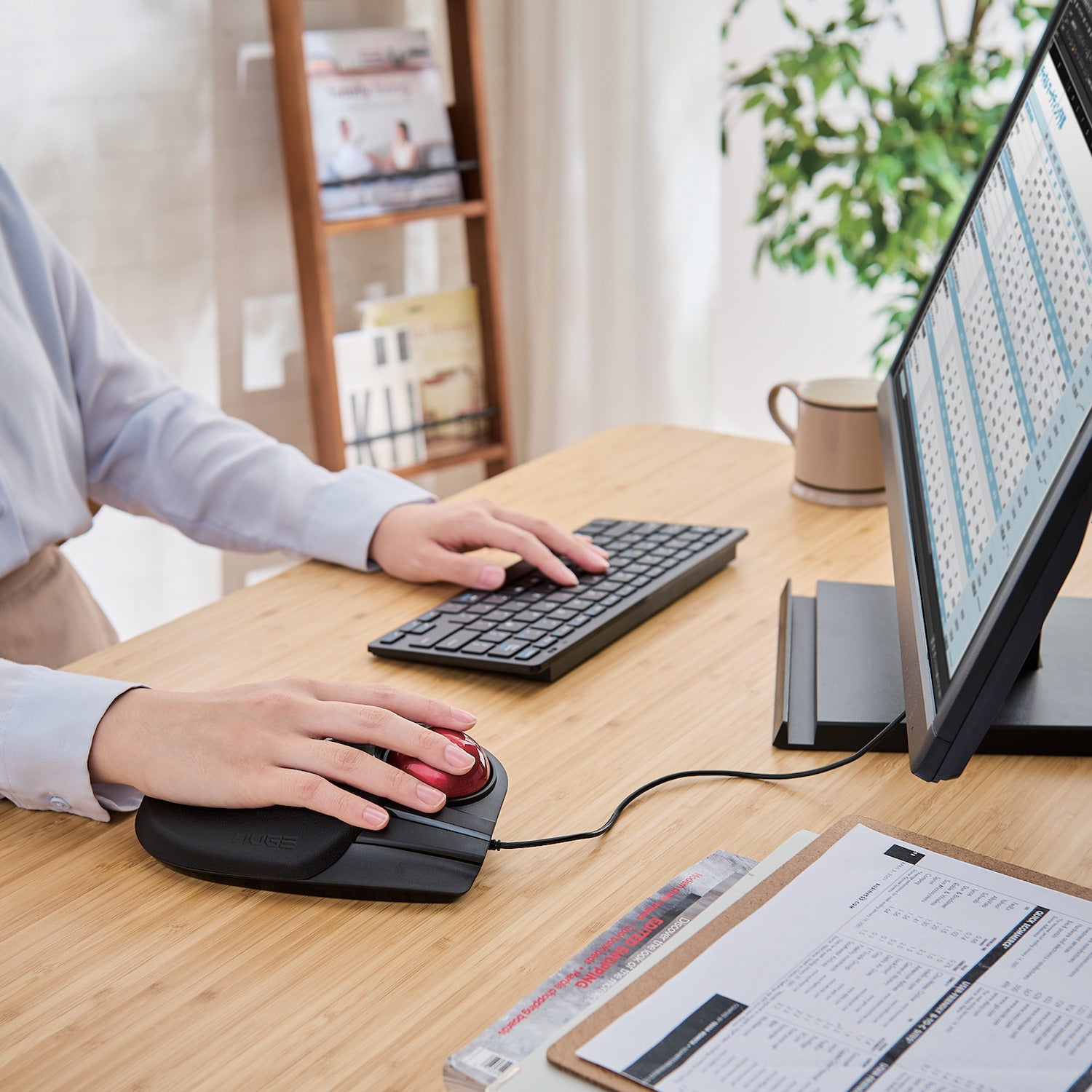 Using Huge Wired Trackball Mouse Red Ball next to keyboard and monitor on a table | Elecom Wired Huge Trackball Mouse