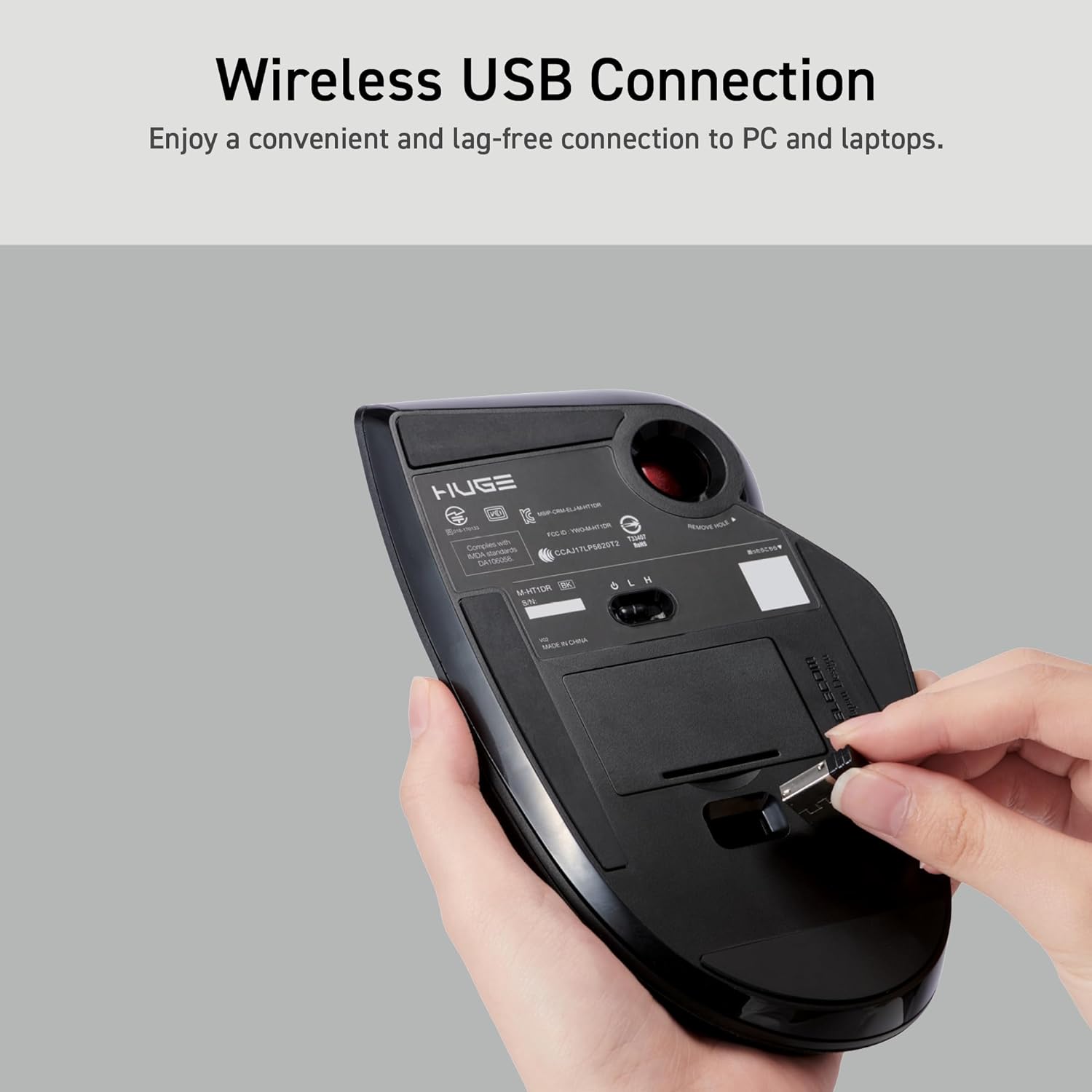 Huge Wireless USB Trackball Mouse Red Ball hands storing USB receiver into its compartment under the mouse | Message reads: Enjoy a convenient and lag-free connection to PC and laptops