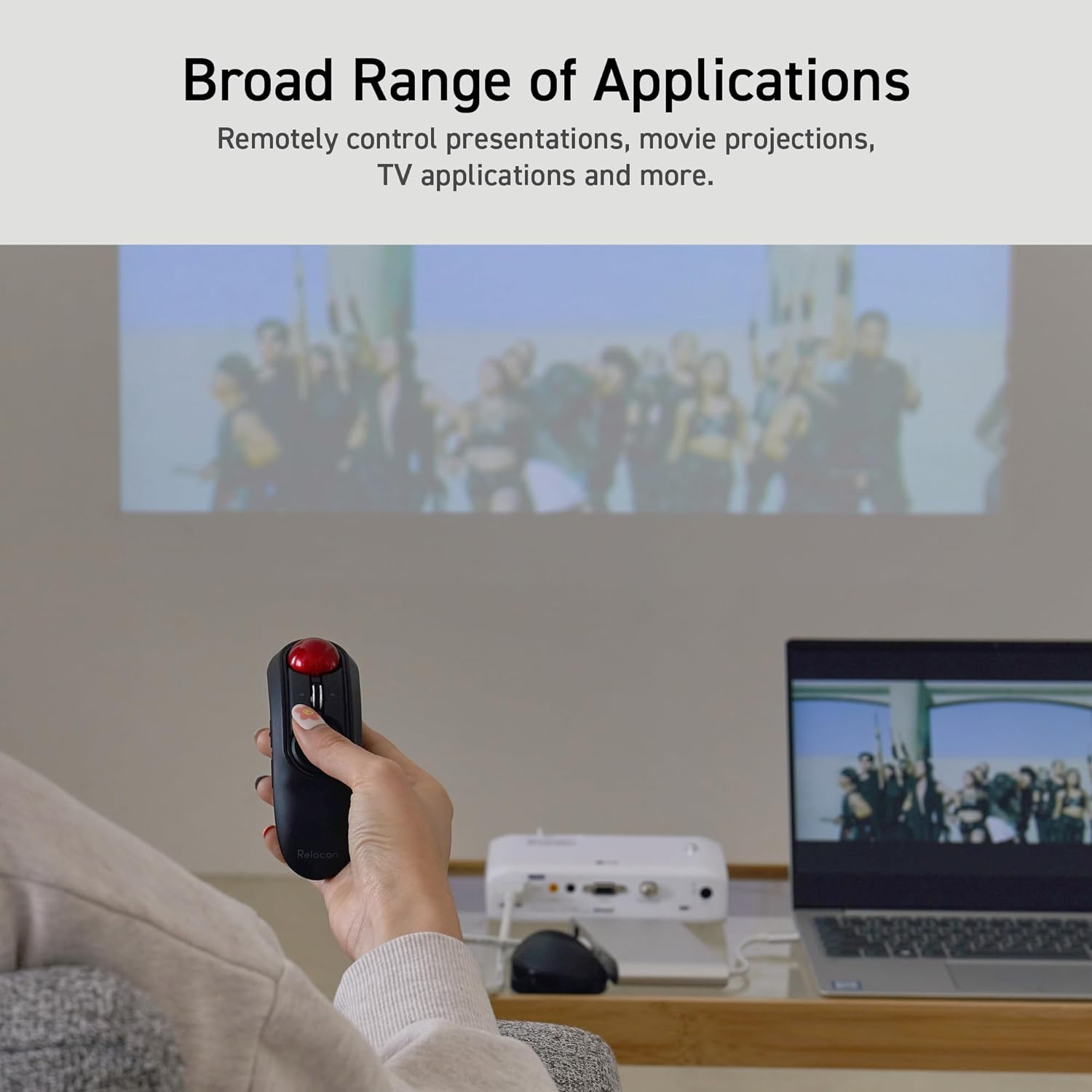 Broad Range of Applications graphic featuring a person using the Relacon on a screen projector that is connected to a laptop | Message reads: Remotely control presentations, movie projections, TV applications and more