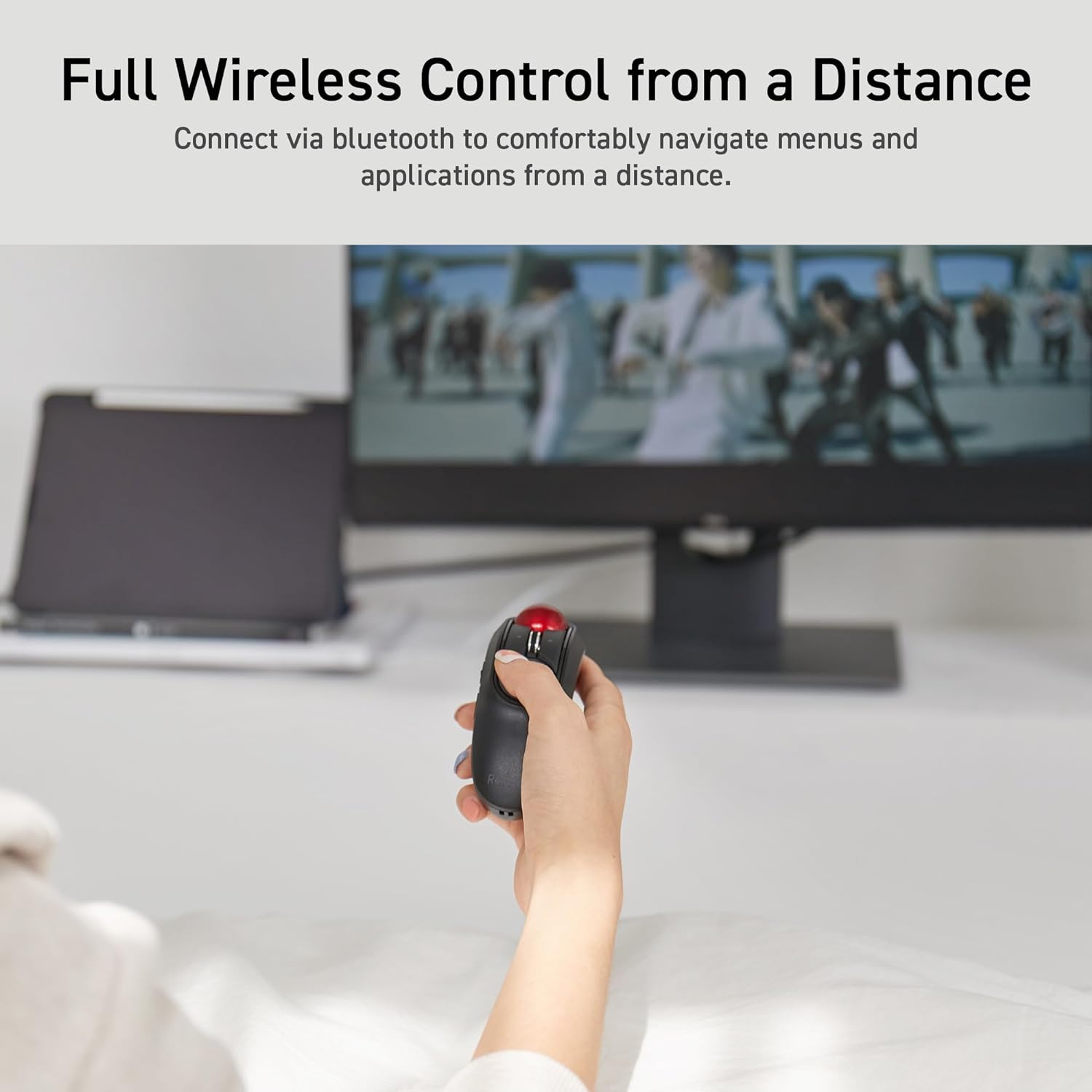 Full Wireless Control from a Distance graphic featuring a person using the Relacon like a TV remote | Message reads: Connect via bluetooth to comfortably navigate menus and applications from a distance