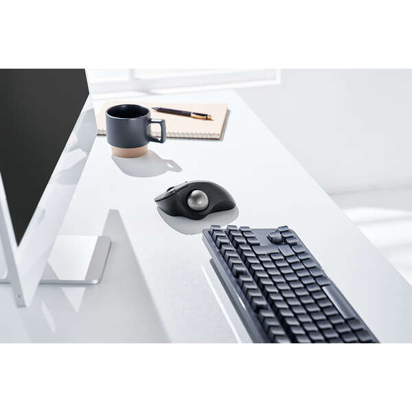 Mac and PC compatible bluetooth connectivity trackball mouse | lifestyle image of white desk with coffee mug, black keyboard, white monitor, and trackball mouse | roller ball mouse