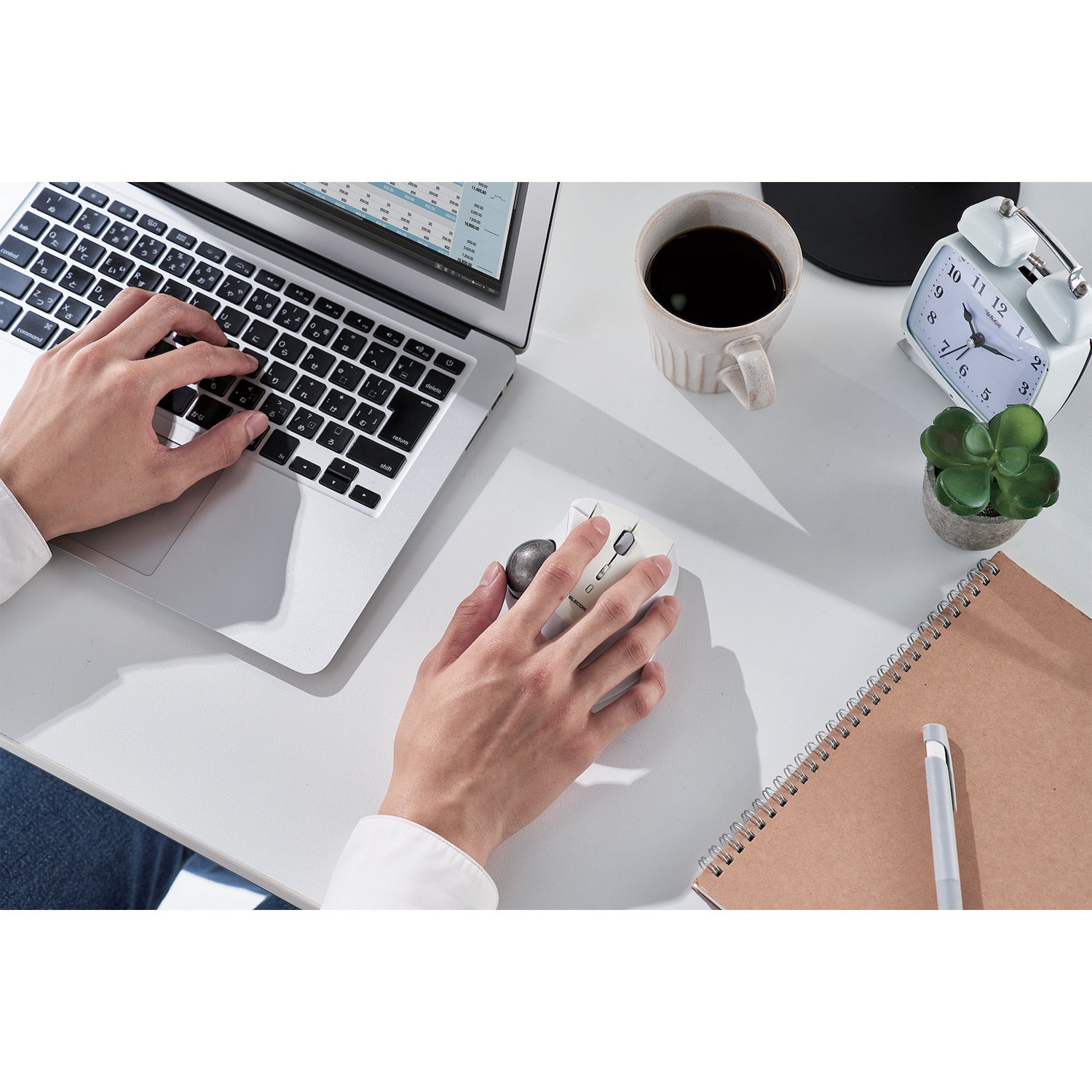 bluetooth connected silver and white trackball mouse in use with silver macbook | 5 programmable buttons