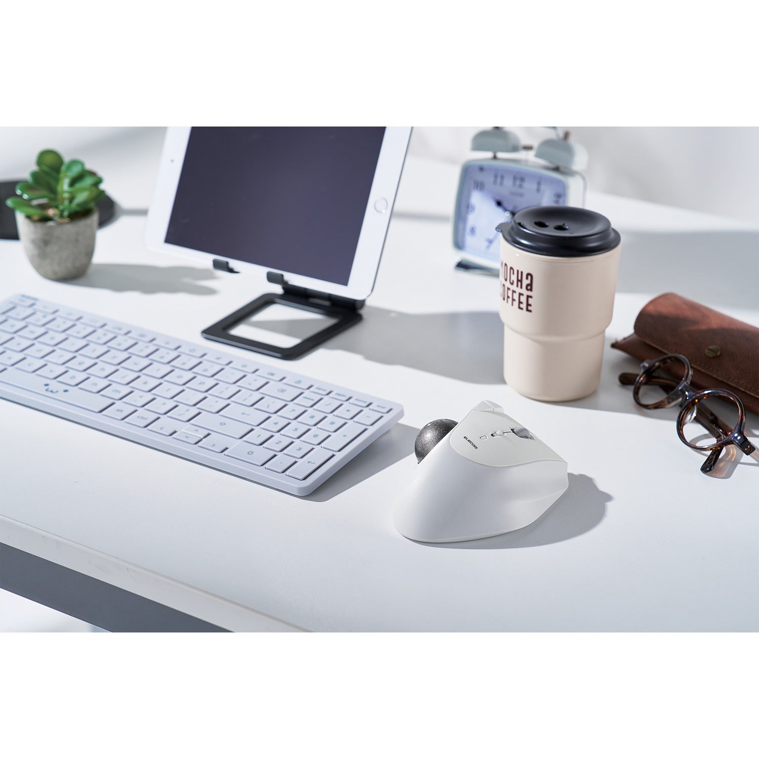 white and silver trackball mouse with ergonomic design