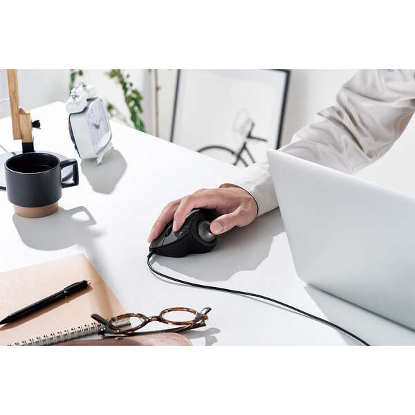 white desk with black accessories and silver laptop computer | black computer mouse | ergonomic trackball mouse
